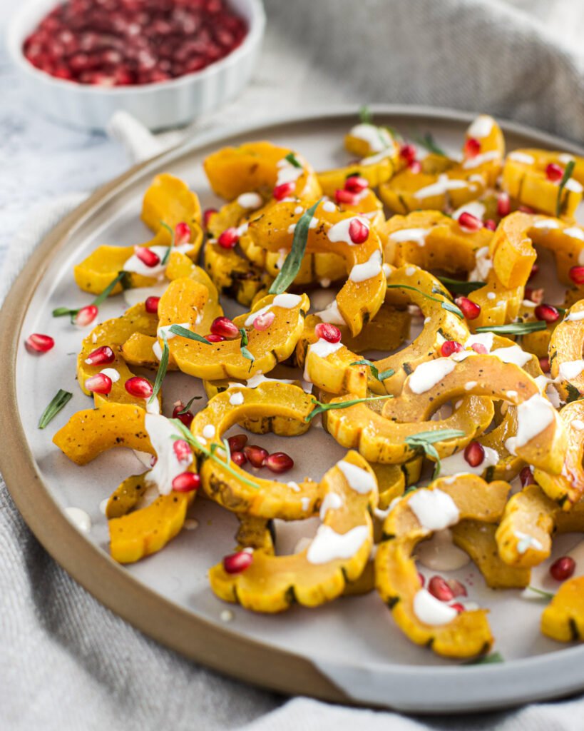 Delicata Squash With Pomegranate and Tahini Sauce